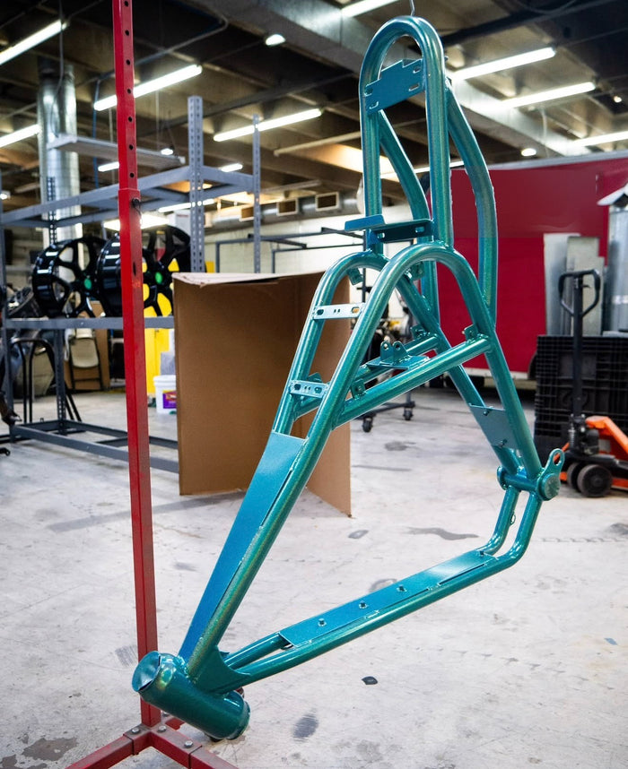 Teal powder-coated frame hanging on the stand
