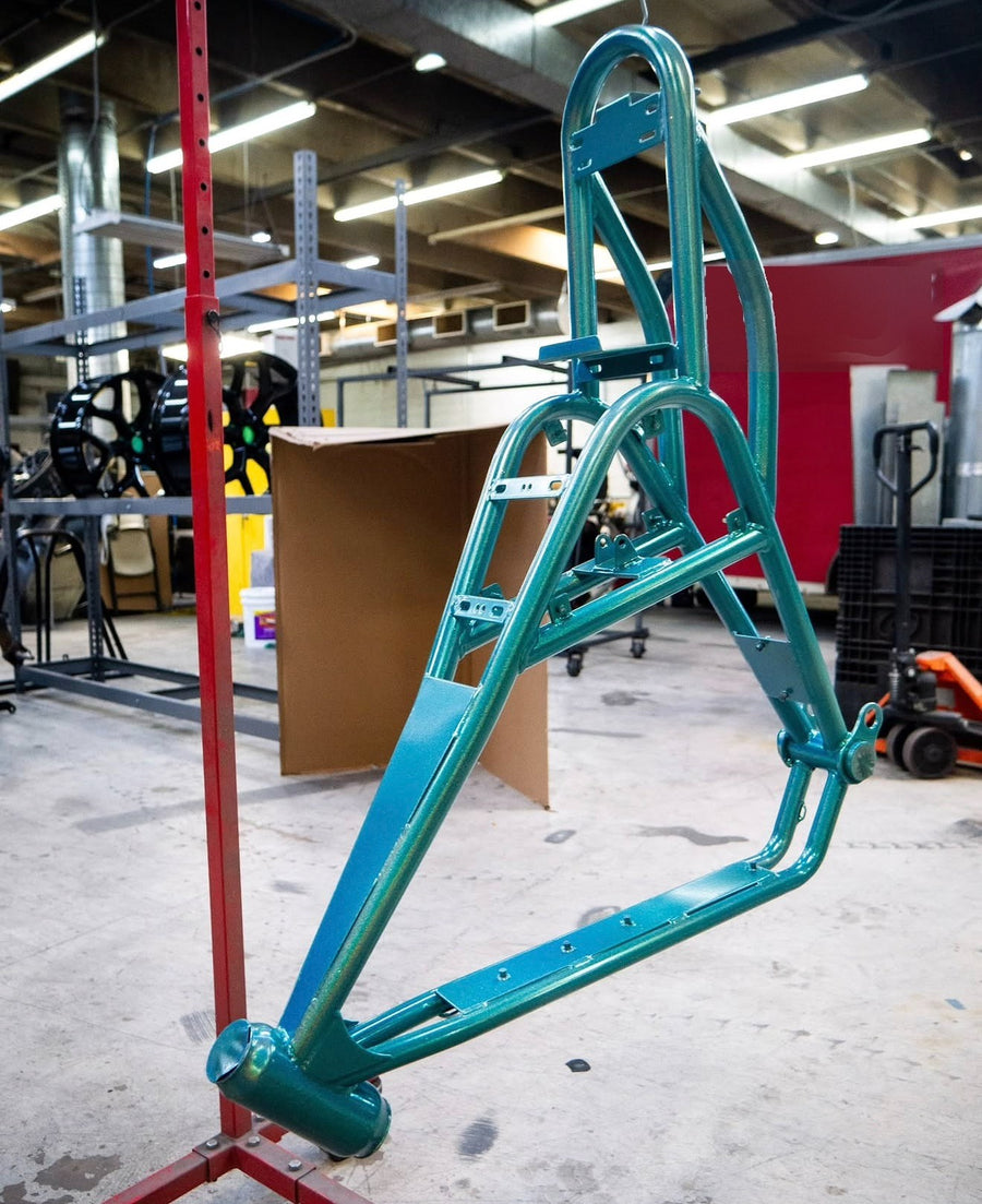 Teal powder-coated frame hanging on the stand