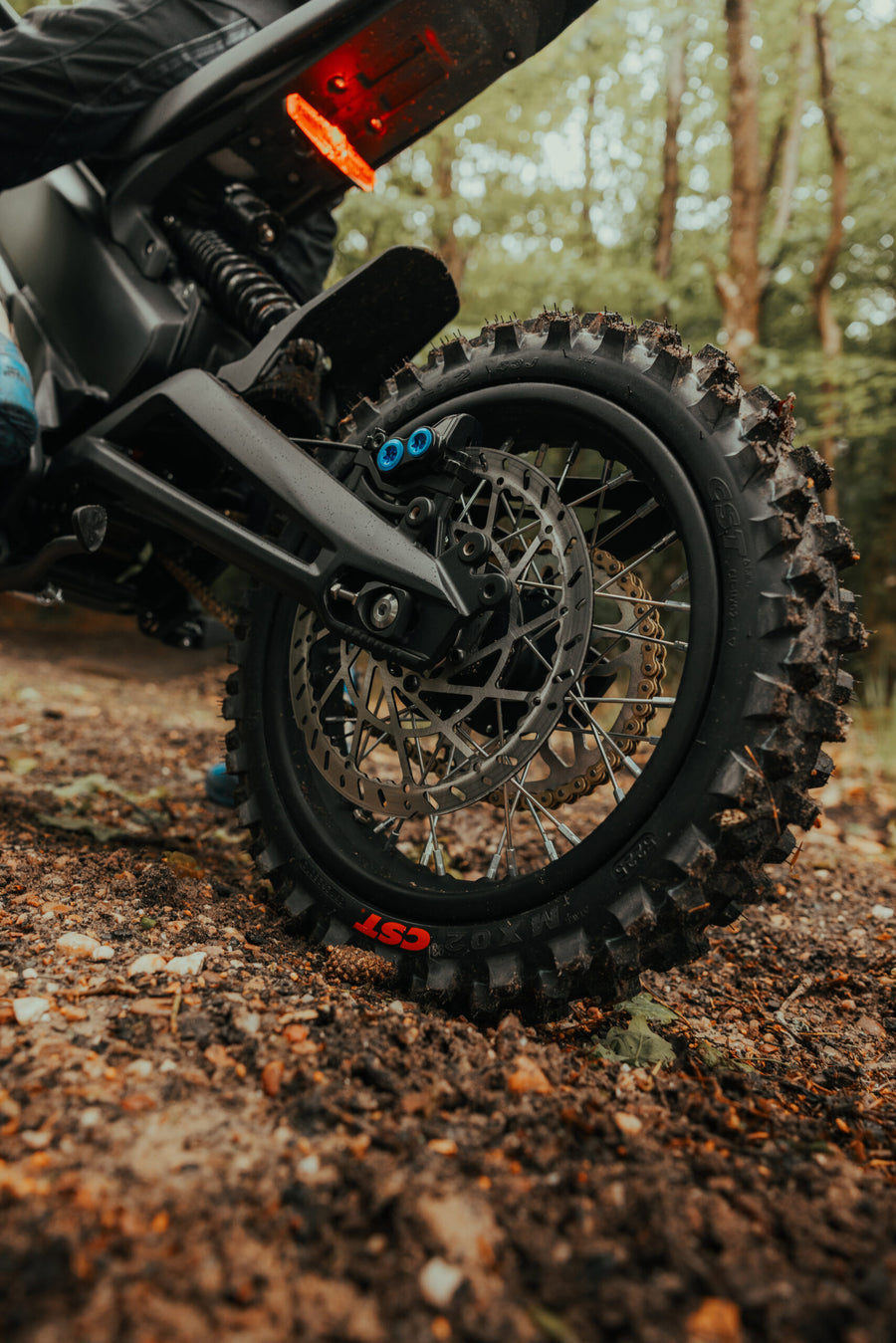 Talaria X3 Mini — rear wheel, chain and swingarm close-up