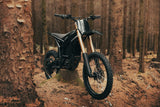 Talaria Komodo in the forest — front three-quarter view