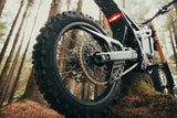 Talaria Komodo — rear wheel, swingarm and chain close-up