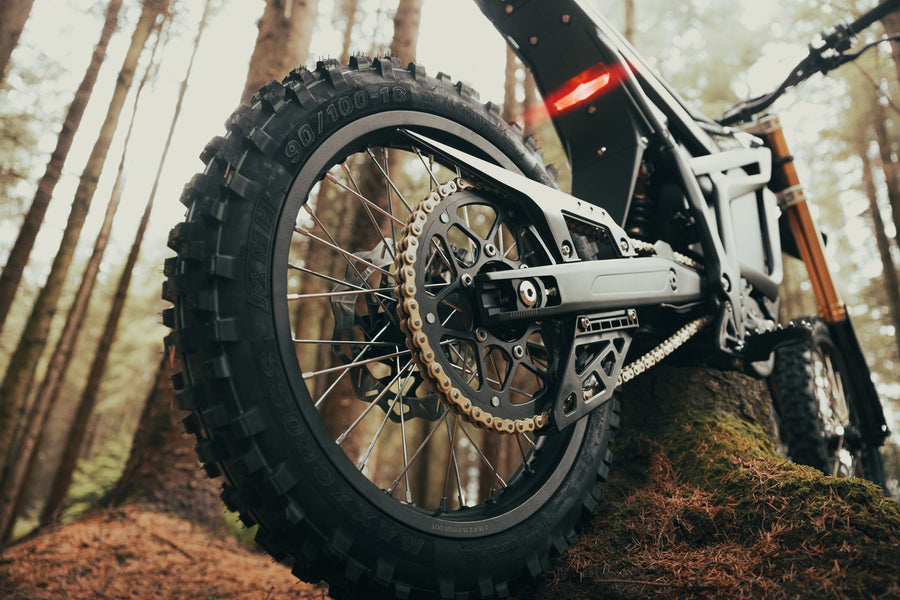 Talaria Komodo — rear wheel, swingarm and chain close-up