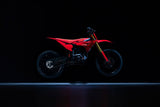 Altis Sigma 2026 electric dirt bike, Red, 19"/19" trail wheels — side profile