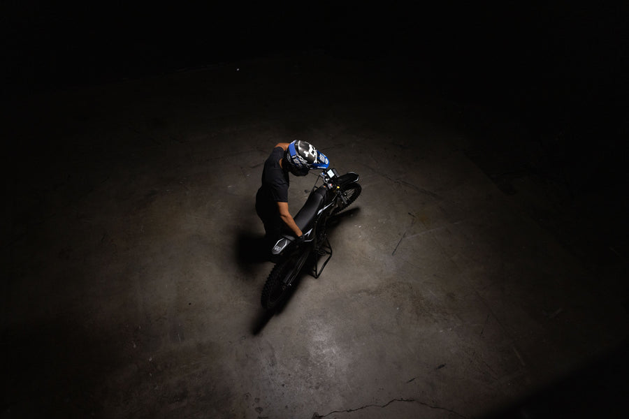 Rider on an Altis Sigma 2026 seen from above under a spotlight