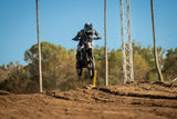 Talaria X3 Mini jumping on a motocross track