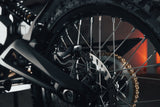 Talaria X3 Pro — rear wheel, chain and swingarm close-up