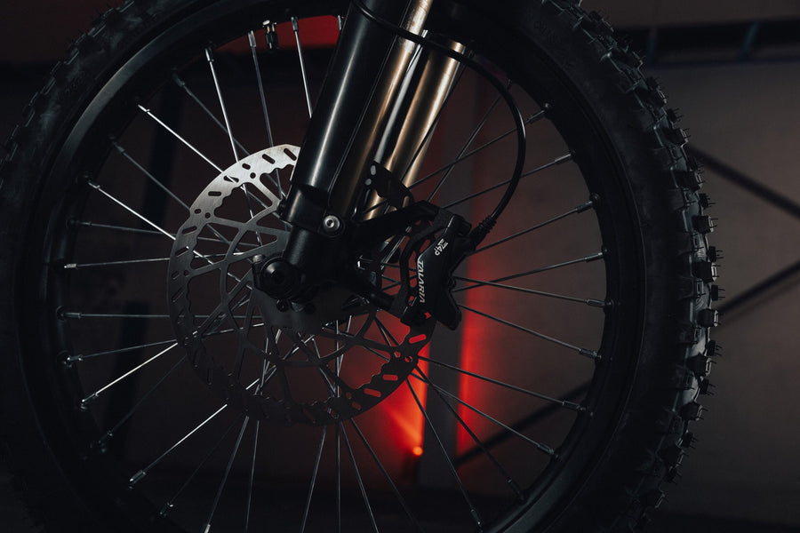 Talaria X3 Pro — front brake rotor, caliper and fork