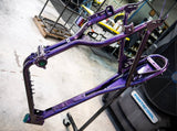 Frame in purple metal-flake powder coat