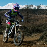 Riding the Sur-Ron Light Bee 2 in Glacier White on a dirt trail